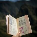 Open passport with travel stamps