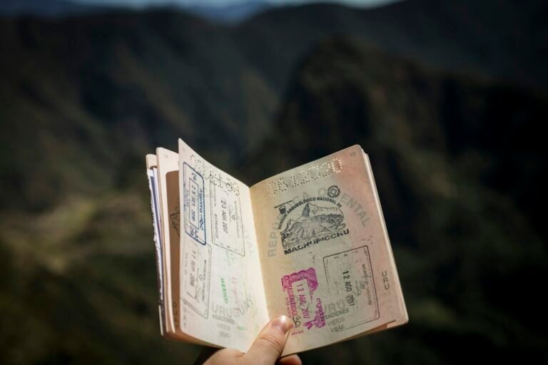 Open passport with travel stamps